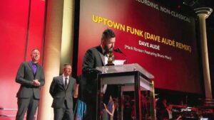 Christian Dwiggins receiving a Grammy for the remix of Uptown Funk